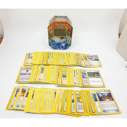 274 - Six boxes of Pokemon cards, some in top load sleeves, spare sleeves and dice. UK shipping £14.