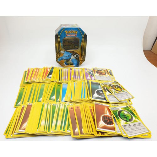 274 - Six boxes of Pokemon cards, some in top load sleeves, spare sleeves and dice. UK shipping £14.