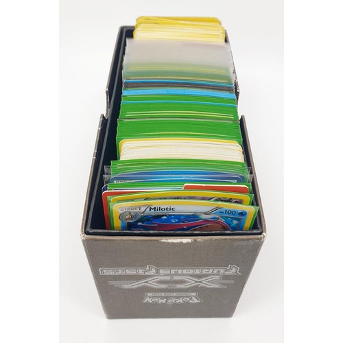 275 - A box of Pokemon cards, mainly Holos and Reverse Holos in top load sleeves. UK shipping £14.