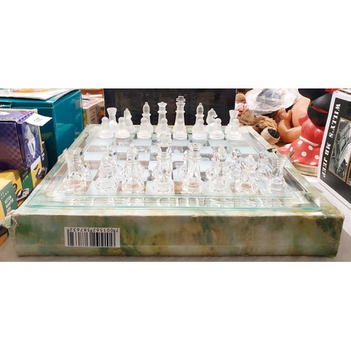 282 - A glass chess set, board size 13.75