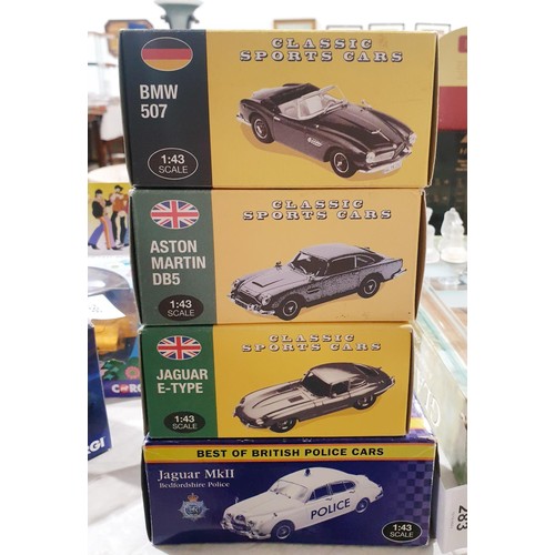 283 - Four boxed Classics Sports Cars and a boxed Best of British Police Cars. UK shipping £14.