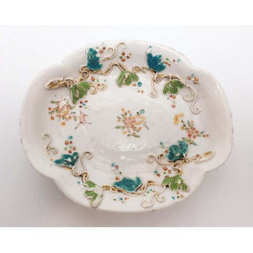 331 - A Japanese relief decorated porcelain dish, width 4.75