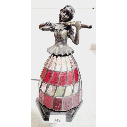 349 - A table lamp in the form of a lady playing a violin, her skirt in the glass Tiffany style, height 10... 