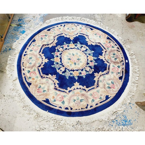 369 - A circular Chinese woollen rug, diameter 70