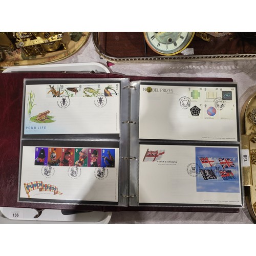 137 - A folder of Disney World of Postage Stamps together with a folder of Royal Mail first day covers. UK... 