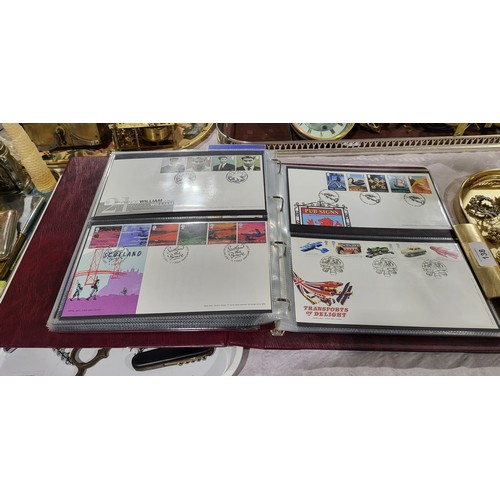 137 - A folder of Disney World of Postage Stamps together with a folder of Royal Mail first day covers. UK... 