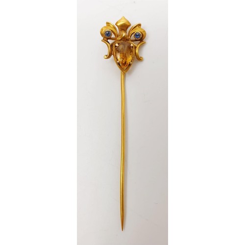 7 - A 14ct gold stick pin set with sapphire and citrine, gross weight 1.8g, length 2.5