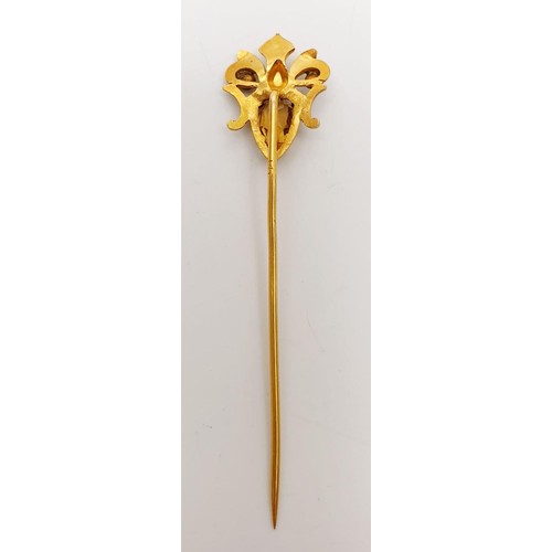 7 - A 14ct gold stick pin set with sapphire and citrine, gross weight 1.8g, length 2.5