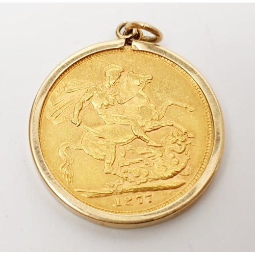 11 - An 1877 sovereign in a 9ct gold pendant mount, weight 9.1g. UK shipping £14.