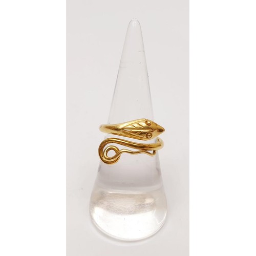 14 - An 18ct gold ring in the form of a serpent, weight 5.5g, size N. UK shipping £14.