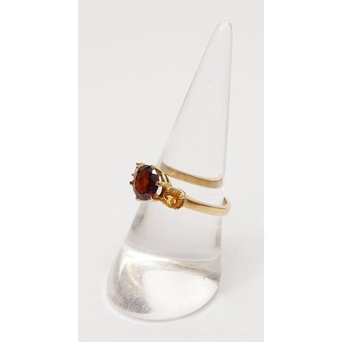 17 - A hallmarked 9ct gold garnet and citrine ring, gross weight 2.4g, size N/O. UK shipping £14.