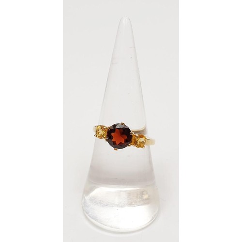 17 - A hallmarked 9ct gold garnet and citrine ring, gross weight 2.4g, size N/O. UK shipping £14.