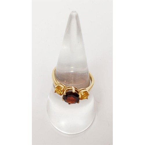 17 - A hallmarked 9ct gold garnet and citrine ring, gross weight 2.4g, size N/O. UK shipping £14.