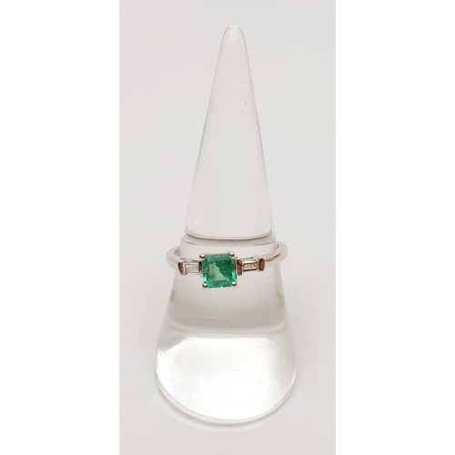 18 - A hallmarked 18ct white gold emerald and diamond ring, gross weight 3.2g, size O. UK shipping £14.