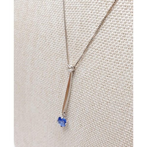 22 - An 18ct white gold pendant set with sapphire and diamond on an 18ct gold chain, chain length 18