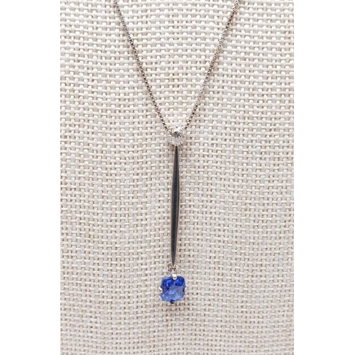 22 - An 18ct white gold pendant set with sapphire and diamond on an 18ct gold chain, chain length 18