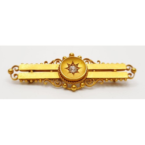 25 - An antique hallmarked 15ct gold bar brooch set with a diamond, gross weight 3.9g, length 2