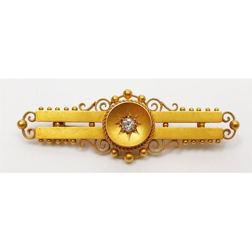 25 - An antique hallmarked 15ct gold bar brooch set with a diamond, gross weight 3.9g, length 2