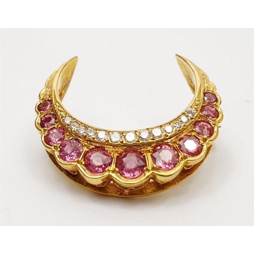 26 - A hallmarked 9ct gold ruby and diamond crescent brooch, gross weight 4g, width 1