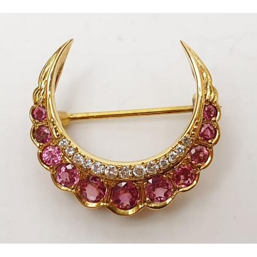 26 - A hallmarked 9ct gold ruby and diamond crescent brooch, gross weight 4g, width 1