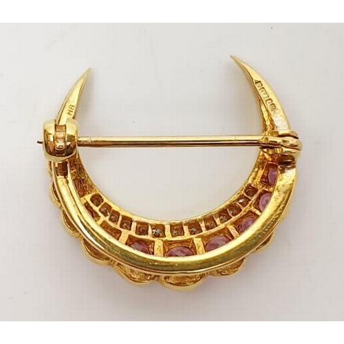 26 - A hallmarked 9ct gold ruby and diamond crescent brooch, gross weight 4g, width 1