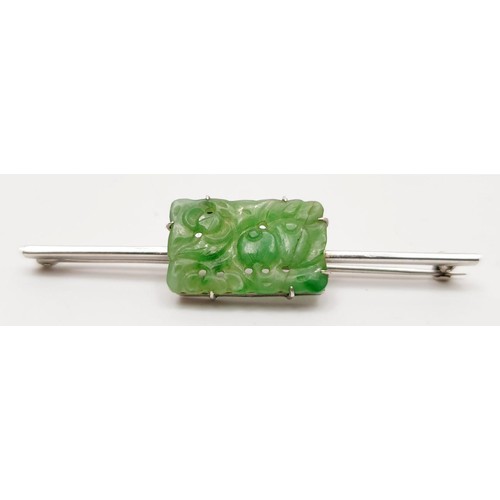 27 - A 9ct white gold bar brooch set with jade, A/F, length 2