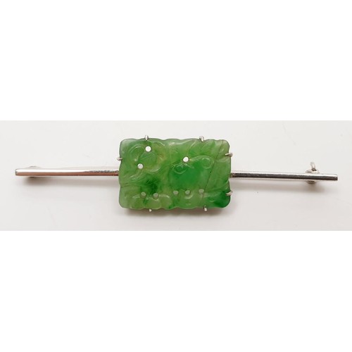 27 - A 9ct white gold bar brooch set with jade, A/F, length 2