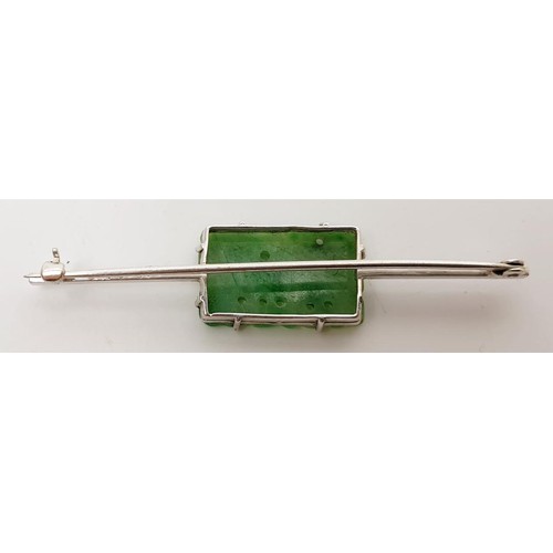 27 - A 9ct white gold bar brooch set with jade, A/F, length 2