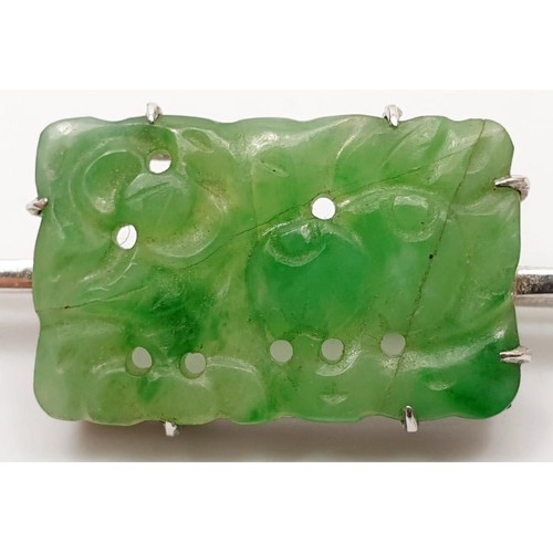 27 - A 9ct white gold bar brooch set with jade, A/F, length 2