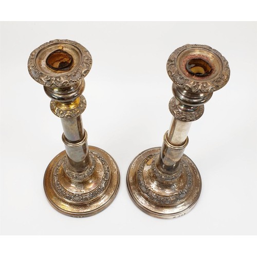 37 - A pair of hallmarked silver weighted George IV candlesticks, by John & Thomas Settle, Gunn & Co., he... 