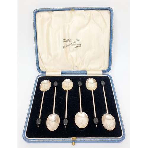 43 - A set of six cased hallmarked silver coffee spoons with coffee bean knops, gross weight 37g, Birming... 