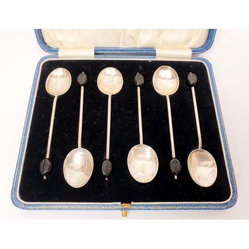 43 - A set of six cased hallmarked silver coffee spoons with coffee bean knops, gross weight 37g, Birming... 