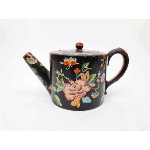 140 - An antique Davenport polychrome teapot, some restoration to the handle, height 3.25