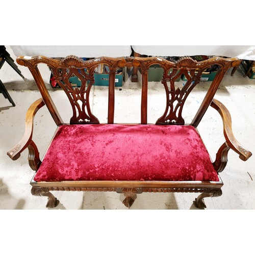 180 - A 1920/30s carved mahogany Chippendale style two seat sofa, width 50