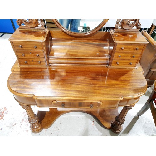 181 - A Victorian mahogany duchess style dressing table on column supports, one central drawer, six small ... 