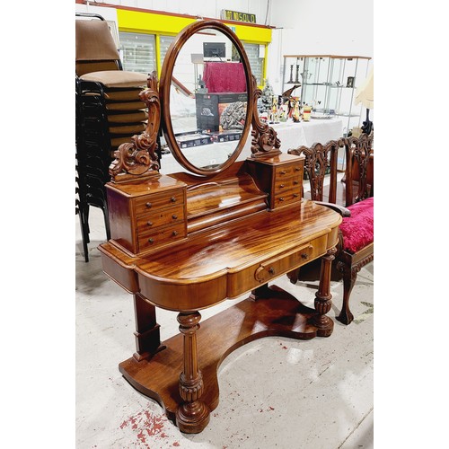 181 - A Victorian mahogany duchess style dressing table on column supports, one central drawer, six small ... 