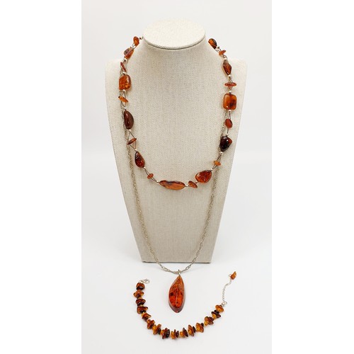 2 - A silver and amber necklace and bracelet, necklace length 19