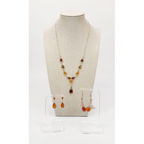 3 - A silver and amber set necklace, length 18