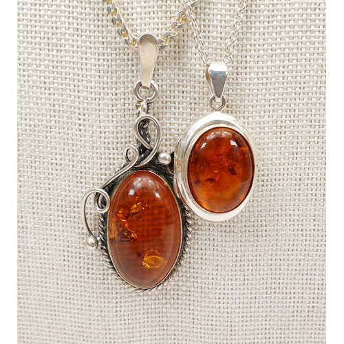 4 - A silver and amber pendant on a silver chain, chain length 19