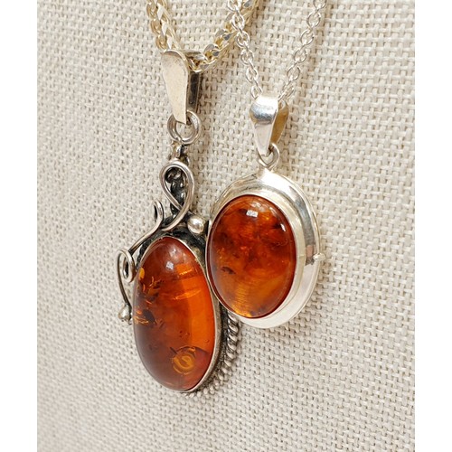 4 - A silver and amber pendant on a silver chain, chain length 19