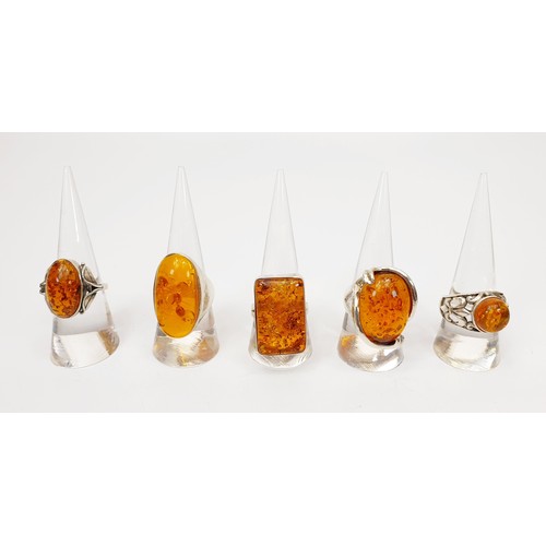 7 - Five silver and amber rings. UK shipping £14. We combine lots.