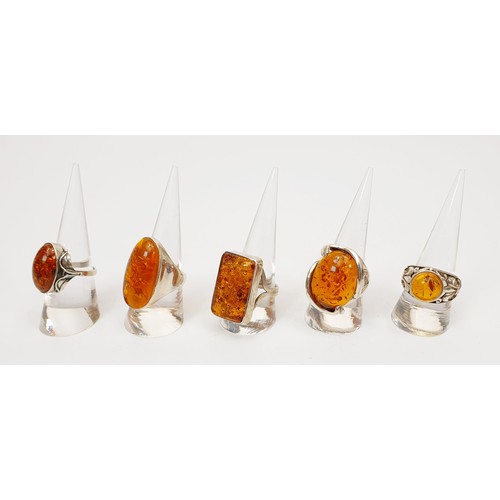 7 - Five silver and amber rings. UK shipping £14. We combine lots.