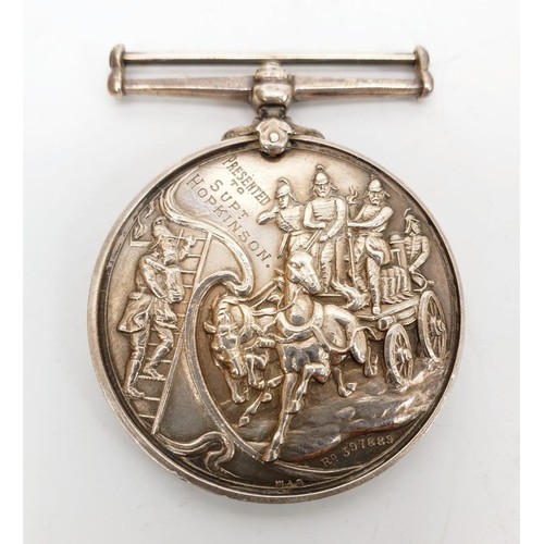 13 - A Victorian hallmarked silver Fire Brigade 21 Year Service Medal, 1882-1903, inscribed 