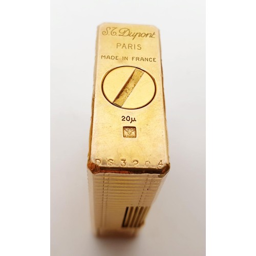 16 - A gold plated St Dupont pocket lighter, height 1.75