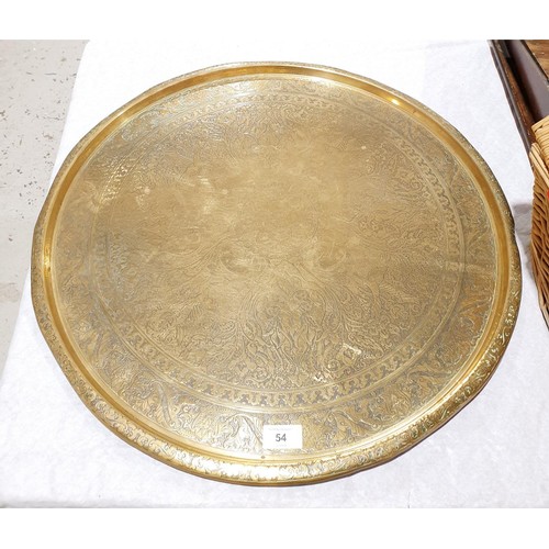 54 - A vintage brass charger, diameter 23