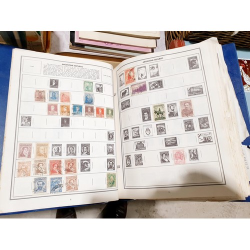 70 - Stamp albums and loose stamps. UK shipping £14.