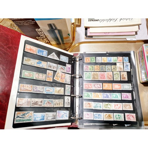 70 - Stamp albums and loose stamps. UK shipping £14.