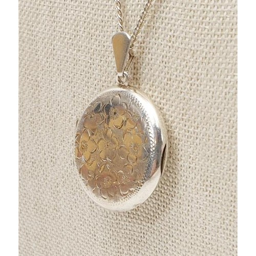 3 - A hallmarked silver locket, diameter 1