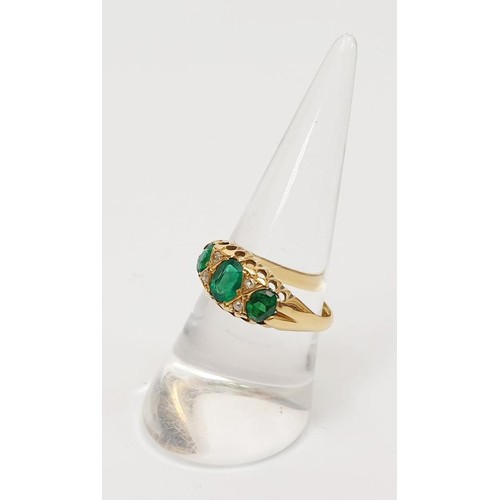 9 - A hallmarked 18ct gold ring set with demantoid garnets, gross weight 3.1g, size P/Q. UK shipping £14... 