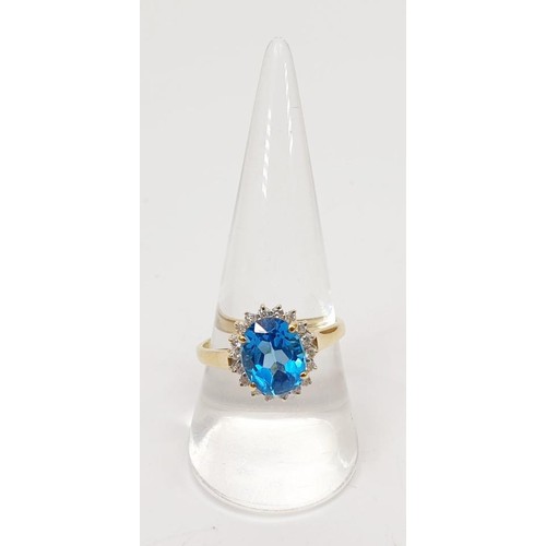 16 - A 9ct gold aquamarine and diamond cluster ring, gross weight 3.4g, size S/T. UK shipping £14.